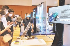Digital transformation solutions are displayed in Ho Chi Minh City in response to National Digital Transformation Day. (Photo: nhandan.vn) 